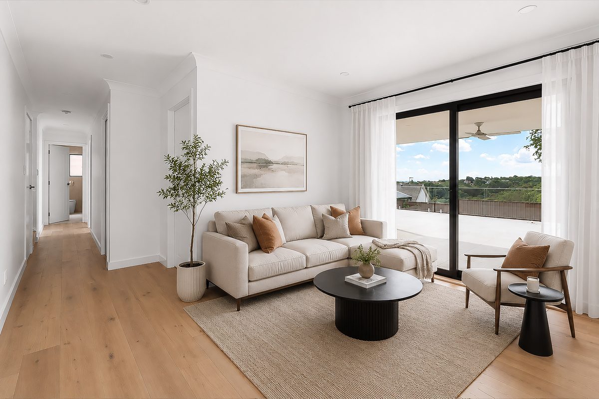 Living room renovation opening to a balcony with coastal outlook